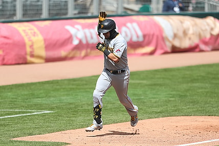 Apr 24, 2021; Minneapolis, Minnesota, USA; Pittsburgh Pirates catcher Michael Perez (5) celebrates as he rounds the bases after hitting a solo home run against the Minnesota Twins in the fifth inning at Target Field. Mandatory Credit: David Berding-USA TODAY Sports