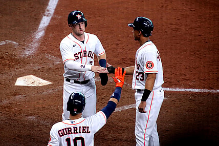 Apr 24, 2021; Houston, Texas, USA; Houston Astros third baseman Alex Bregman (2, left) is congratulated by left fielder Michael Brantley (23) after scoring a run against the Los Angeles Angels during the fifth inning at Minute Maid Park. Mandatory Credit: Erik Williams-USA TODAY Sports