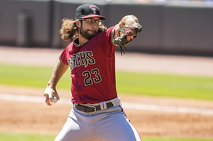 Apr 25, 2021; Cumberland, Georgia, USA; Arizona Diamondbacks starting pitcher Zac Gallen (23) pitches against the Atlanta Braves during the second inning at Truist Park. Mandatory Credit: Dale Zanine-USA TODAY Sports