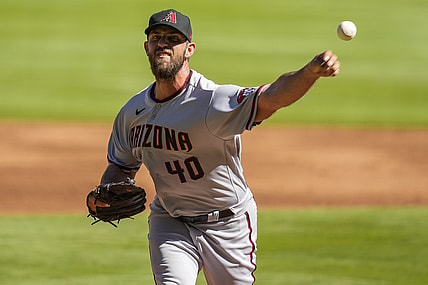 Apr 25, 2021; Cumberland, Georgia, USA; Arizona Diamondbacks starting pitcher Madison Bumgarner (40) pitches against the Atlanta Braves during the first inning at Truist Park. Mandatory Credit: Dale Zanine-USA TODAY Sports