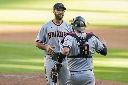 Apr 25, 2021; Cumberland, Georgia, USA; Arizona Diamondbacks starting pitcher Madison Bumgarner (40) reacts with teammates after pitching a seven inning no hit no run game against the Atlanta Braves in game two at Truist Park. Mandatory Credit: Dale Zanine-USA TODAY Sports