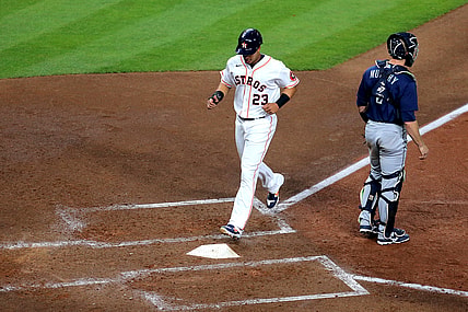 Apr 27, 2021; Houston, Texas, USA; Houston Astros left fielder Michael Brantley (23) scores a run against the Seattle Mariners during the fourth inning at Minute Maid Park. Mandatory Credit: Erik Williams-USA TODAY Sports