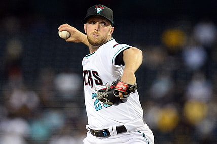 Apr 27, 2021; Phoenix, Arizona, USA; Arizona Diamondbacks starting pitcher Merrill Kelly (29) pitches against the San Diego Padres during the third inning at Chase Field. Mandatory Credit: Joe Camporeale-USA TODAY Sports