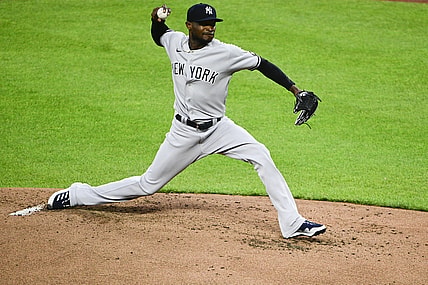 Apr 28, 2021; Baltimore, Maryland, USA;  New York Yankees starting pitcher Domingo German (55) delivers a pitch during the second inning against the Baltimore Orioles at Oriole Park at Camden Yards. Mandatory Credit: Tommy Gilligan-USA TODAY Sports