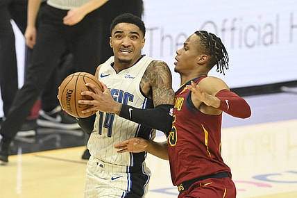 Apr 28, 2021; Cleveland, Ohio, USA; Orlando Magic guard Gary Harris (14) drives against Cleveland Cavaliers forward Isaac Okoro (35) in the second quarter at Rocket Mortgage FieldHouse. Mandatory Credit: David Richard-USA TODAY Sports