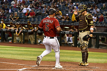 Apr 28, 2021; Phoenix, Arizona, USA;  Arizona Diamondbacks third baseman Eduardo Escobar (5) scores in the second inning against the San Diego Padres at Chase Field. Mandatory Credit: Matt Kartozian-USA TODAY Sports