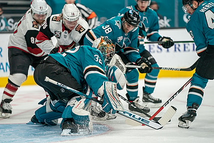 Apr 28, 2021; San Jose, California, USA;  San Jose Sharks goaltender Josef Korenar (32) makes a save against Arizona Coyotes center Christian Dvorak (18) during the first period at SAP Center at San Jose. Mandatory Credit: Neville E. Guard-USA TODAY Sports