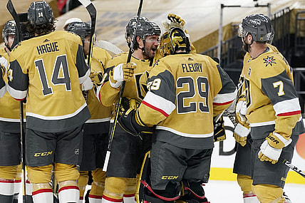 Apr 28, 2021; Las Vegas, Nevada, USA; Vegas Golden Knights defenseman Alec Martinez, center left, celebrates with goaltender Marc-Andre Fleury (29) after defeating the Colorado Avalanche at T-Mobile Arena. Mandatory Credit:  John Locher/POOL PHOTOS-USA TODAY Sports