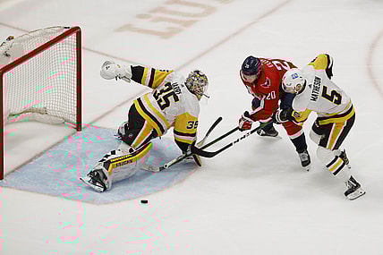Apr 29, 2021; Washington, District of Columbia, USA; Pittsburgh Penguins goaltender Tristan Jarry (35) makes a save on Washington Capitals center Lars Eller (20) as Penguins defenseman Mike Matheson (5) defends in the first period at Capital One Arena. Mandatory Credit: Geoff Burke-USA TODAY Sports