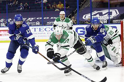 wApr 29, 2021; Tampa, Florida, USA;Tampa Bay Lightning left wing Alex Killorn (17) battles for the puck with center Alex Barre-Boulet (60) and Dallas Stars defenseman Esa Lindell (23) during the first period at Amalie Arena. Mandatory Credit: Kim Klement-USA TODAY Sports