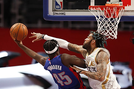 Apr 29, 2021; Detroit, Michigan, USA; Detroit Pistons forward Sekou Doumbouya (45) gets fouled by Dallas Mavericks center Willie Cauley-Stein (33) during the second quarter at Little Caesars Arena. Mandatory Credit: Raj Mehta-USA TODAY Sports