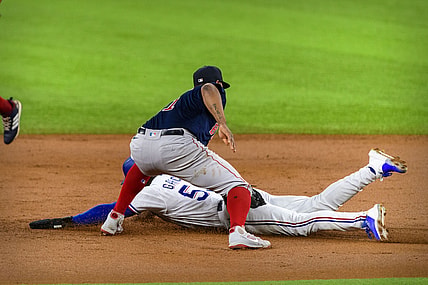 Apr 29, 2021; Arlington, Texas, USA; Boston Red Sox third baseman Rafael Devers (11) tags out Texas Rangers right fielder Adolis Garcia (53) during the second inning at Globe Life Field. Mandatory Credit: Jerome Miron-USA TODAY Sports
