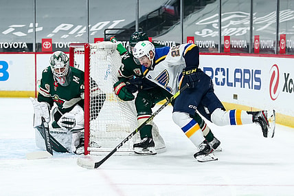 Apr 29, 2021; Saint Paul, Minnesota, USA; Minnesota Wild goaltender Cam Talbot (33) defends his net against St. Louis Blues center Jordan Kyrou (25) while Minnesota Wild defenseman Ian Cole (28) defends in the first period at Xcel Energy Center. Mandatory Credit: David Berding-USA TODAY Sports