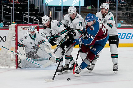 Apr 30, 2021; Denver, Colorado, USA; Colorado Avalanche center Carl Soderberg (34) battles for the puck with San Jose Sharks defenseman Erik Karlsson (65) and defenseman Nikolai Knyzhov (71) and center Tomas Hertl (48) as goaltender Martin Jones (31) defends in the first period at Ball Arena. Mandatory Credit: Isaiah J. Downing-USA TODAY Sports