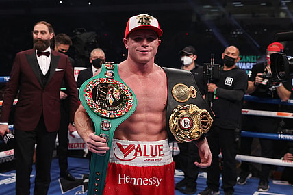 Dec 19, 2020; San Antonio, TX, USA;   Canelo Alvarez (red trunks) celebrates after defeating Callum Smith (white trunks) during their WBA, WBC and Ring Magazine super middleweight championship bout at the Alamodome in San Antonio, TX. Mandatory Credit: Ed Mulholland/Handout Photo via USA TODAY Sports