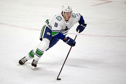 Mar 15, 2021; Ottawa, Ontario, CAN; Vancouver Canucks right wing Jake Virtanen (18) skates with the puck in the third period against the Ottawa Senators at the Canadian Tire Centre. Mandatory Credit: Marc DesRosiers-USA TODAY Sports