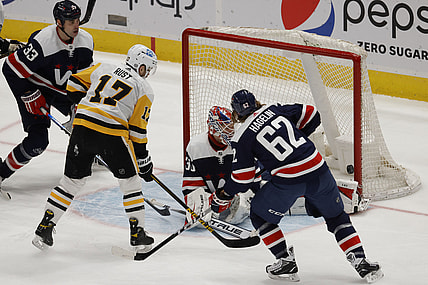 May 1, 2021; Washington, District of Columbia, USA; Pittsburgh Penguins right wing Bryan Rust (17) shoots the puck on Washington Capitals goaltender Ilya Samsonov (30) as Capitals left wing Carl Hagelin (62) defends in the third period at Capital One Arena. Mandatory Credit: Geoff Burke-USA TODAY Sports