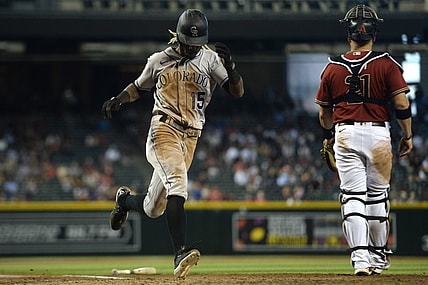 May 2, 2021; Phoenix, Arizona, USA; Colorado Rockies left fielder Raimel Tapia (15) scores a run against the Arizona Diamondbacks during the eighth inning at Chase Field. Mandatory Credit: Joe Camporeale-USA TODAY Sports