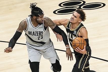 May 3, 2021; Atlanta, Georgia, USA; Portland Trail Blazers forward Robert Covington (23) is called for a foul while defending Atlanta Hawks guard Trae Young (11) during the first quarter at State Farm Arena. Mandatory Credit: Dale Zanine-USA TODAY Sports