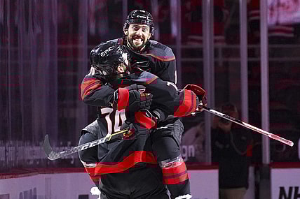 May 3, 2021; Raleigh, North Carolina, USA;  Carolina Hurricanes center Vincent Trocheck (16) and defenseman Jaccob Slavin (74) celebrate their in against the Chicago Blackhawks at PNC Arena. Mandatory Credit: James Guillory-USA TODAY Sports