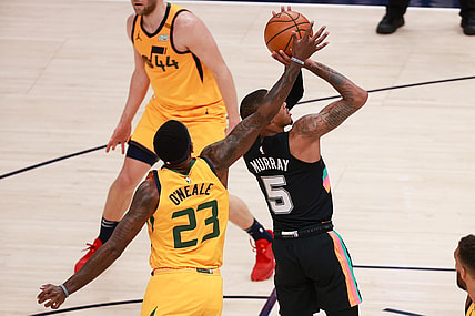 May 3, 2021; Salt Lake City, Utah, USA;  Utah Jazz forward Royce O'Neale (23) blocks the shot of San Antonio Spurs guard Dejounte Murray (5) during the second quarter at Vivint Arena. Mandatory Credit: Chris Nicoll-USA TODAY Sports