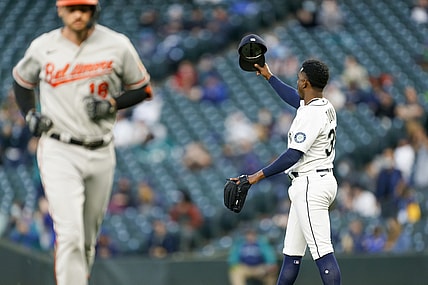 May 4, 2021; Seattle, Washington, USA; Seattle Mariners starting pitcher Justin Dunn (35) tips his hat following a catch along the wall on a fly ball by Baltimore Orioles first baseman Trey Mancini (16) during the third inning at T-Mobile Park. Mandatory Credit: Joe Nicholson-USA TODAY Sports