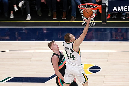 May 5, 2021; Salt Lake City, Utah, USA;  Utah Jazz forward Bojan Bogdanovic (44) gets past San Antonio Spurs forward Luka Samanic (19) and to the basket during the third quarter at Vivint Arena. Utah Jazz won 126-94. Mandatory Credit: Chris Nicoll-USA TODAY Sports
