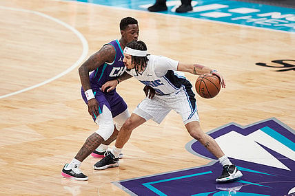 May 7, 2021; Charlotte, North Carolina, USA; Orlando Magic guard Cole Anthony (50) is defended by Charlotte Hornets guard Terry Rozier (3) during first quarter action at Spectrum Center. Mandatory Credit: Brian Westerholt-USA TODAY Sports
