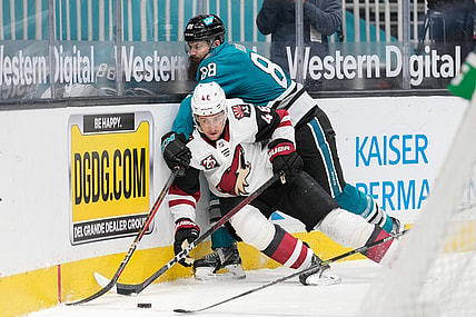 May 7, 2021; San Jose, California, USA; San Jose Sharks defenseman Brent Burns (88) collides into Arizona Coyotes defenseman Ilya Lyubushkin (46) during the third period at SAP Center at San Jose. Mandatory Credit: Stan Szeto-USA TODAY Sports