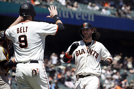 May 8, 2021; San Francisco, California, USA; San Francisco Giants shortstop Brandon Crawford (35) celebrates with first baseman Brandon Belt (9) after hitting a home run during the second inning against the San Diego Padres at Oracle Park. Mandatory Credit: Darren Yamashita-USA TODAY Sports