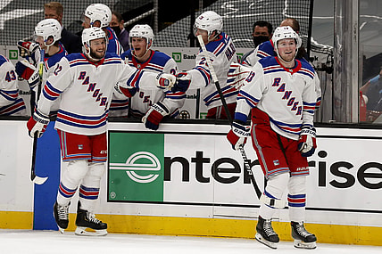 May 8, 2021; Boston, Massachusetts, USA; New York Rangers left wing Alexis Lafreni re (13) smiles after being congratulated at the bench after scoring with defenseman Anthony Bitetto (22) during the third period of their 5-4 win over the Boston Bruins at TD Garden. Mandatory Credit: Winslow Townson-USA TODAY Sports