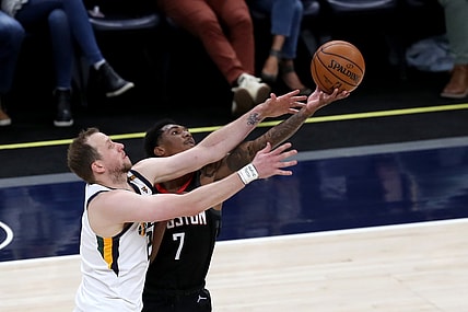 May 8, 2021; Salt Lake City, Utah, USA; Utah Jazz guard Joe Ingles (left) and Houston Rockets guard Armoni Brooks (7) battle for a loose ball in the second quarter at Vivint Arena. Mandatory Credit: Rob Gray-USA TODAY Sports