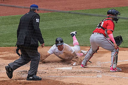 May 9, 2021; Bronx, New York, USA; New York Yankees left fielder Brett Gardner (11) scores a run behind Washington Nationals catcher Yan Gomes (10) during the third inning at Yankee Stadium. Mandatory Credit: Vincent Carchietta-USA TODAY Sports