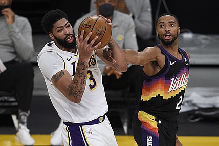 May 9, 2021; Los Angeles, California, USA; Los Angeles Lakers forward Anthony Davis (3) grabs the rebound against Phoenix Suns forward Mikal Bridges (25) during the first half at Staples Center. Mandatory Credit: Kelvin Kuo-USA TODAY Sports