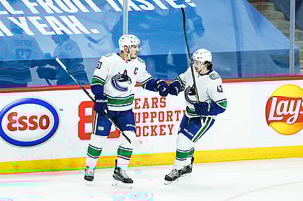 May 10, 2021; Winnipeg, Manitoba, CAN;  Vancouver Canucks forward Bo Horvat (53) is congratulated by Vancouver Canucks defenseman Quinn Hughes (43) on his goal against the Winnipeg Jets during the first period at Bell MTS Place. Mandatory Credit: Terrence Lee-USA TODAY Sports
