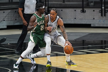 May 10, 2021; San Antonio, Texas, USA; San Antonio Spurs forward DeMar DeRozan (10) dribbles against Milwaukee Bucks guard Jrue Holiday (21) in the first half at the AT&T Center. Mandatory Credit: Daniel Dunn-USA TODAY Sports