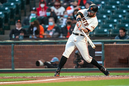May 10, 2021; San Francisco, California, USA; San Francisco Giants first baseman Brandon Belt (9) hits a solo home run during the fourth inning against the Texas Rangers at Oracle Park. Mandatory Credit: Neville E. Guard-USA TODAY Sports