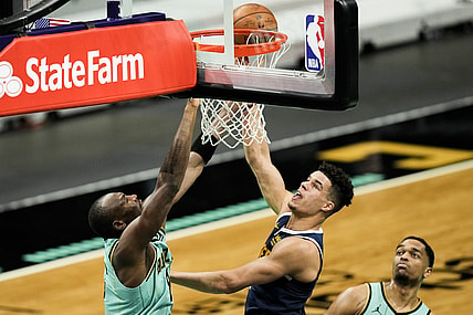 May 11, 2021; Charlotte, North Carolina, USA; Denver Nuggets forward Michael Porter Jr. (1) goes up for a layup covered by Charlotte Hornets center Bismack Biyombo (8) during the second quarter at the  Spectrum Center. Mandatory Credit: Jim Dedmon-USA TODAY Sports