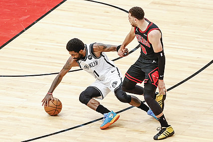 May 11, 2021; Chicago, Illinois, USA; Chicago Bulls guard Zach LaVine (8) fouls Brooklyn Nets guard Kyrie Irving (11) during the first half at United Center. Mandatory Credit: Kamil Krzaczynski-USA TODAY Sports
