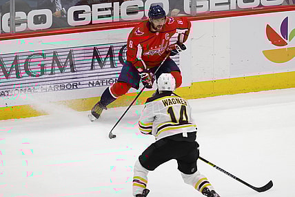 May 11, 2021; Washington, District of Columbia, USA; Washington Capitals left wing Alex Ovechkin (8) skates with the puck as Boston Bruins right wing Chris Wagner (14) defends in the second period at Capital One Arena. Mandatory Credit: Geoff Burke-USA TODAY Sports