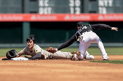 May 12, 2021; Denver, Colorado, USA; San Diego Padres shortstop Ha-Seong Kim (7) safely slides into second ahead of a tag from Colorado Rockies third baseman Ryan McMahon (24) in the second inning at Coors Field. Mandatory Credit: Isaiah J. Downing-USA TODAY Sports