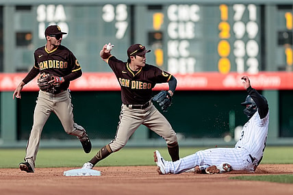 May 12, 2021; Denver, Colorado, USA; San Diego Padres shortstop Ha-Seong Kim (7) attempts to turn a double play as Colorado Rockies first baseman Connor Joe (9) slides out into second as second baseman Tucupita Marcano (16) looks on in the first inning at Coors Field. Mandatory Credit: Isaiah J. Downing-USA TODAY Sports