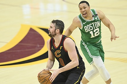 May 12, 2021; Cleveland, Ohio, USA; Cleveland Cavaliers forward Kevin Love (0) looks to shoot a three-point basket beside Boston Celtics forward Grant Williams (12) the third quarter at Rocket Mortgage FieldHouse. Mandatory Credit: David Richard-USA TODAY Sports
