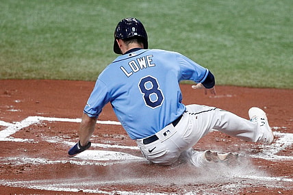May 13, 2021; St. Petersburg, Florida, USA;  Tampa Bay Rays second baseman Brandon Lowe (8) scores a run in the first inning against the New York Yankees at Tropicana Field. Mandatory Credit: Nathan Ray Seebeck-USA TODAY Sports