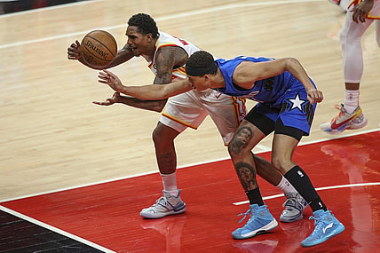 May 13, 2021; Atlanta, Georgia, USA; Atlanta Hawks guard Lou Williams (6) and Orlando Magic guard R.J. Hampton (13) reach for a loose ball in the first quarter at State Farm Arena. Mandatory Credit: Brett Davis-USA TODAY Sports