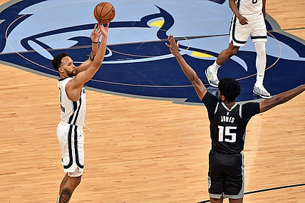 May 13, 2021; Memphis, Tennessee, USA; Memphis Grizzlies forward Kyle Anderson (1) shoots against Sacramento Kings center Damian Jones (15) during the first half  at FedExForum. Mandatory Credit: Justin Ford-USA TODAY Sports