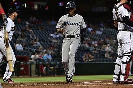 May 13, 2021; Phoenix, Arizona, USA; Miami Marlins center fielder Magneuris Sierra (C) scores a run during the third inning against the Arizona Diamondbacks at Chase Field. Mandatory Credit: Matt Kartozian-USA TODAY Sports