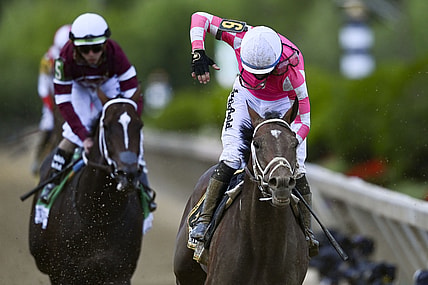 May 15, 2021; Baltimore, Maryland, USA; Flavien Prat aboard  Rombauer reacts after winning the  146th running of the Preakness Stakes at Pimlico Race Course. Mandatory Credit: Tommy Gilligan-USA TODAY Sports
