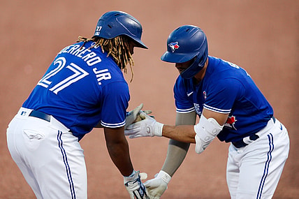 May 15, 2021; Dunedin, Florida, CAN;  Toronto Blue Jays center fielder Randal Grichuk (15) congratulates first baseman Vladimir Guerrero Jr. (27) after hitting a home run in the first inning against the Philadelphia Phillies at TD Ballpark. Mandatory Credit: Nathan Ray Seebeck-USA TODAY Sports