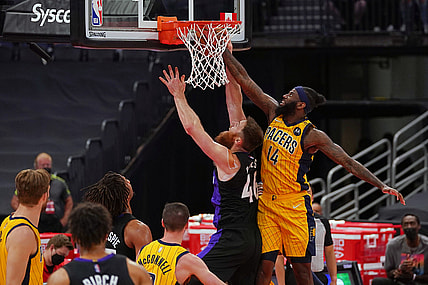 May 16, 2021; Tampa, Florida, USA; Indiana Pacers forward JaKarr Sampson (14) fouls Toronto Raptors center Aron Baynes (46) during the first half at Amalie Arena. Mandatory Credit: Jasen Vinlove-USA TODAY Sports